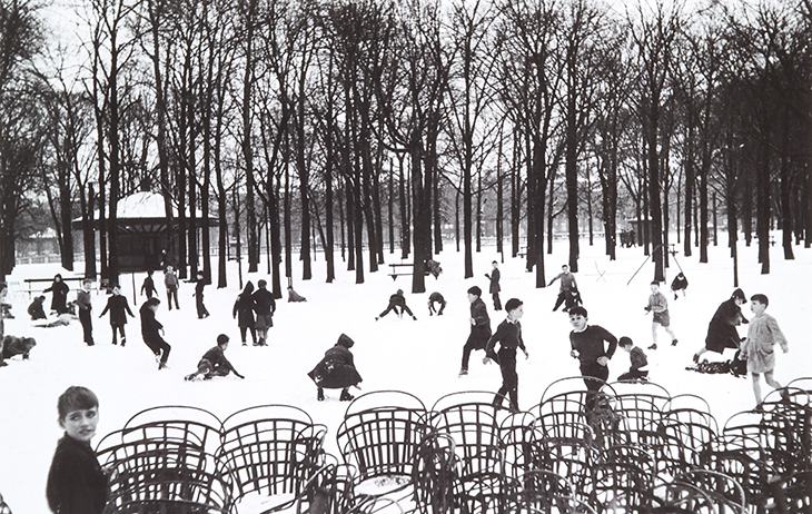 Black-and-white photo of people playing in the snow