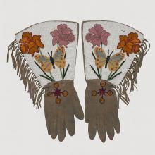 <a href="https://spencerartapps.ku.edu/collection-search#/object/32252" target="_blank"><i>pair of beaded gauntlets (gloves)</i> by Blackfoot or Dakelh (Carrier) peoples</a>