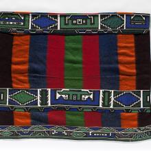<a href="https://spencerartapps.ku.edu/collection-search#/object/34615" target="_blank"><i>wearing blanket</i> by Ndebele peoples</a>