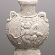 <a href="https://spencerartapps.ku.edu/collection-search#/object/42964" target="_blank"><i>bianhu (pilgrimage flask) with dancing monkey</i> by China</a>