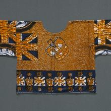 <a href="https://spencerartapps.ku.edu/collection-search#/object/43860" target="_blank"><i>woman's shirt with Queen Elizabeth II</i> by Hausa-Fulani peoples</a>