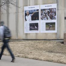 A student looks on Bell's <i>Venus Williams</i> installation on the side of Haworth Hall on KU's Lawrence campus. This artwork is part of Bell's <i>Counternarratives</i> series. 