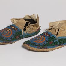 <a href='https://spencerartapps.ku.edu/collection-search#/object/32064' target='_blank'><i>pair of beaded moccasins</i>, unknown Cheyenne maker</a>