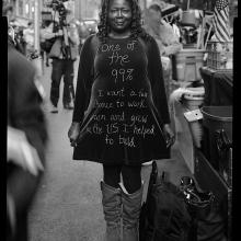 <a href='https://spencerartapps.ku.edu/collection-search#/object/62950' target='_blank'><i>Shadow, a performance artist who was making video portraits of protestors</i> by Accra Shepp</a>