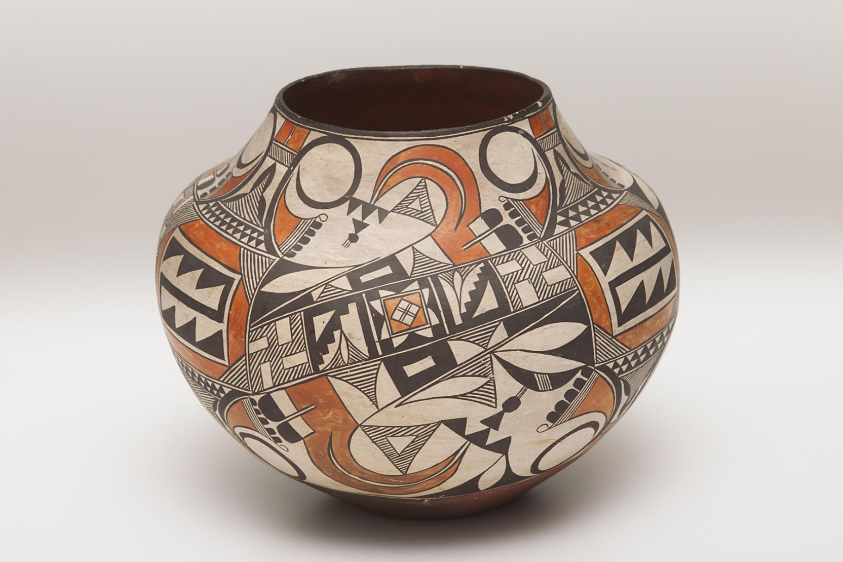 Ceramic pot with a combination of geometric and organic shapes in shades of black and brown