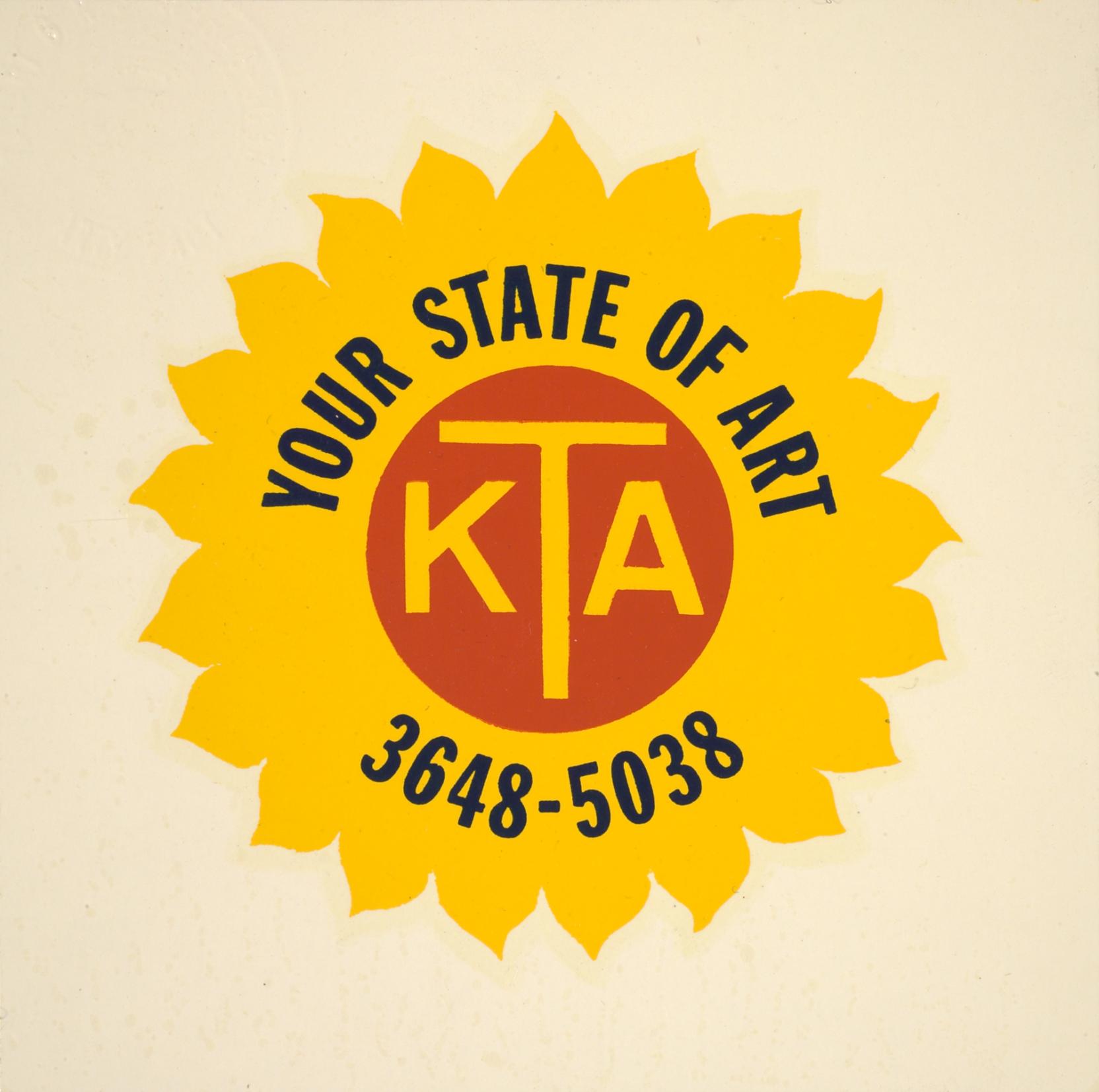 A yellow sunflower with an orange center featuring the letters KTA and the words “YOUR STATE OF ART 3648-5038” surrounding it