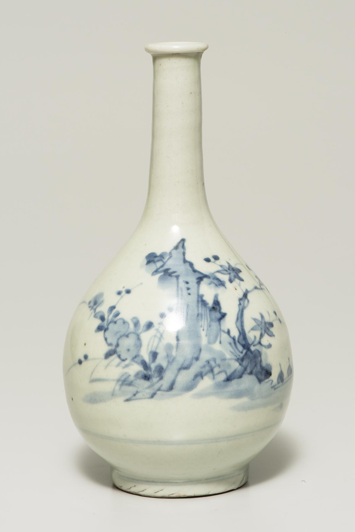 a bulbous white bottle with a long, narrow neck is decorated with rocks, butterflies, and flowers
